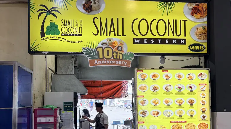 Small Coconut MJC 38 — lit shopfront sign and counter